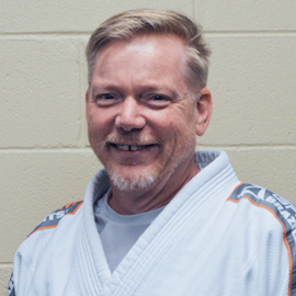 Mike has been training Brazilian Jiu-Jitsu for over 10 years, nine of those years with Nick Metzinger. Mike also holds a Black Belt in Filipino Jiu-Jitsu and Modern Arnis.